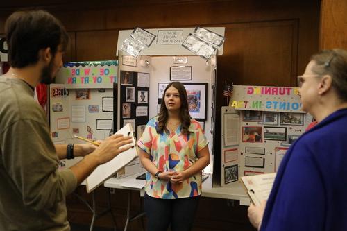 High school student gives presentation at competition